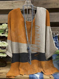 Blusa casual bicolor amarilla con cuello redondo y manga larga