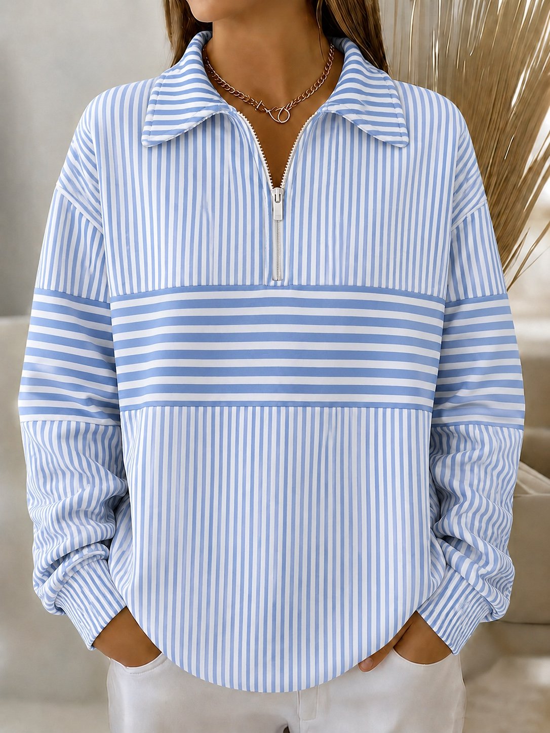 Sudadera bicolor con cuello camisero, manga larga y media cremallera