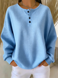 Top liso de tejido gofre con cuello henley y manga larga