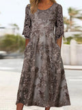 Vestido midi de encaje con cuello redondo y manga tres cuartos