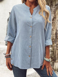 Blusa holgada de rayas con cuello camisero y manga larga · Vera