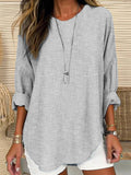 Blusa holgada de rayas con cuello redondo y manga larga