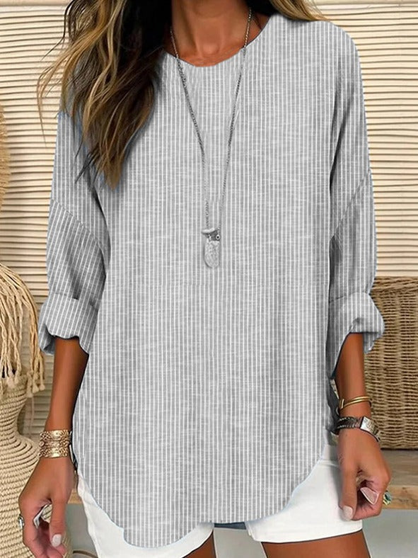 Blusa holgada de rayas con cuello redondo y manga larga