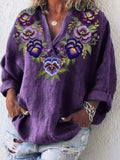 Blusa holgada de flores con escote en pico y manga larga