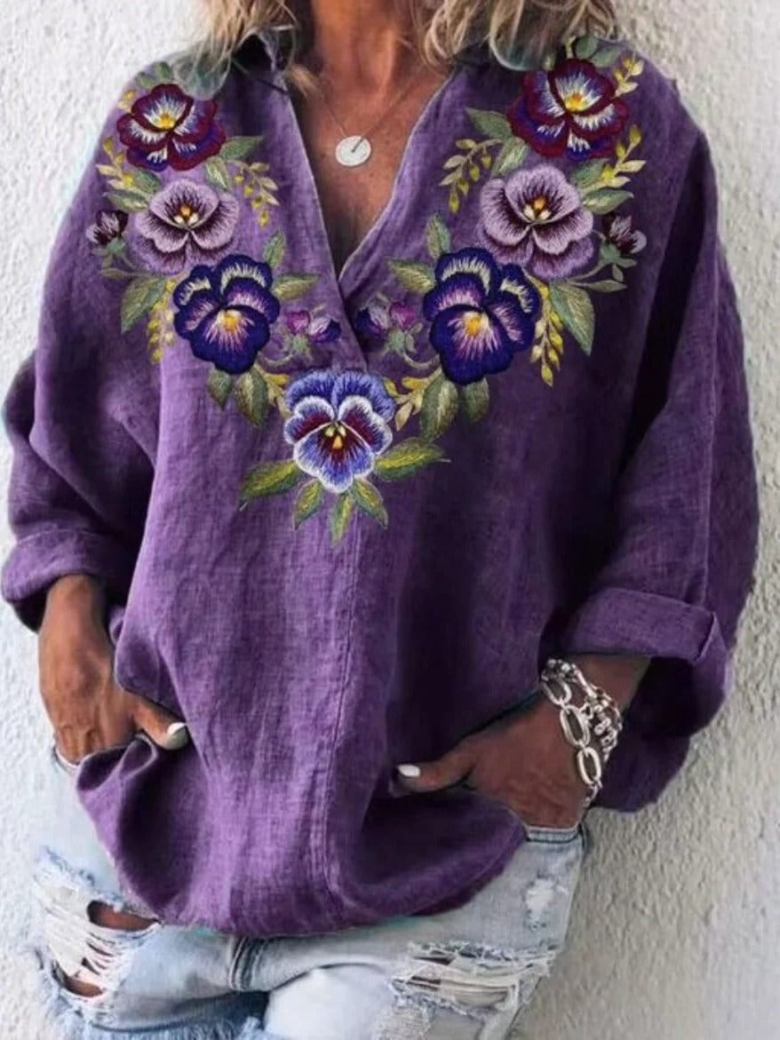 Blusa holgada de flores con escote en pico y manga larga