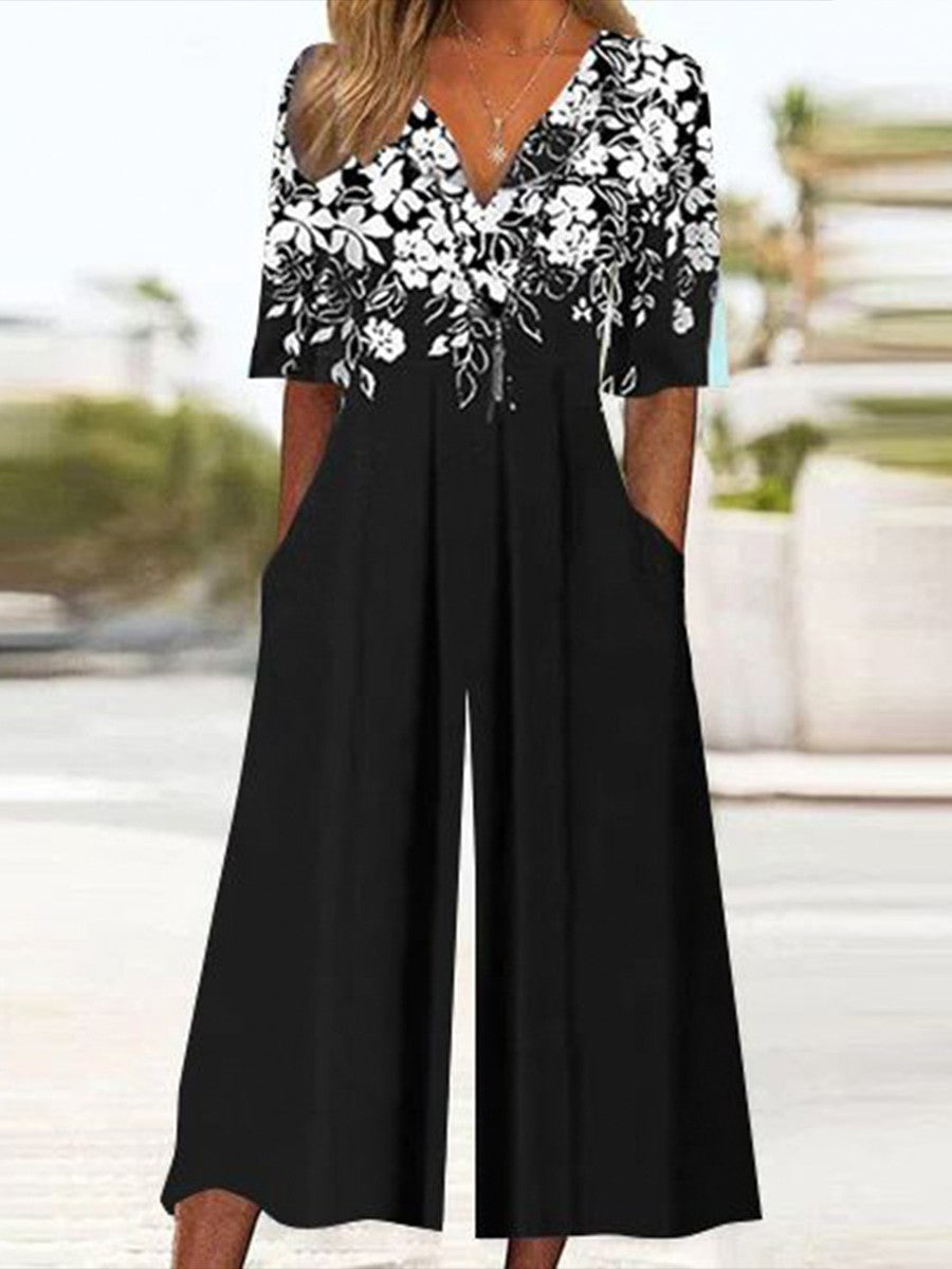 Mono de flores negro con escote en pico y manga francesa
