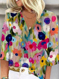 Blusa romántica de flores con escote en pico y manga tres cuartos
