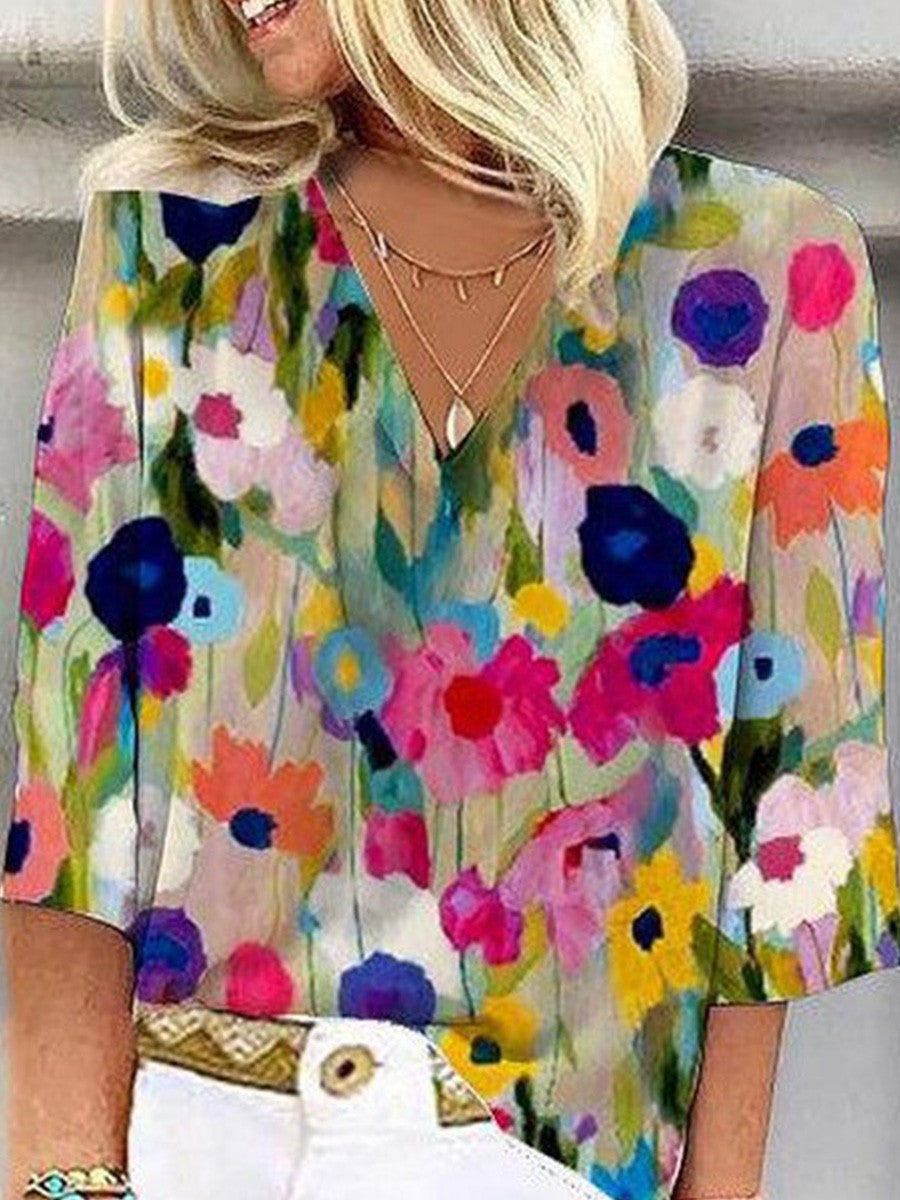 Blusa romántica de flores con escote en pico y manga tres cuartos