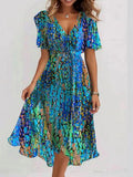 Vestido midi azul con escote en pico y manga corta