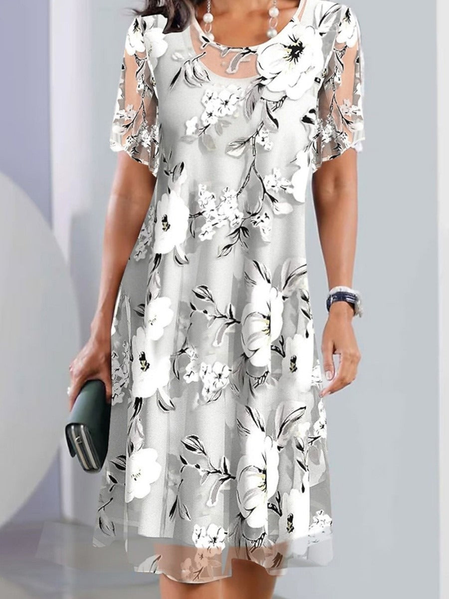 Vestido elegante midi de flores con cuello redondo y manga corta