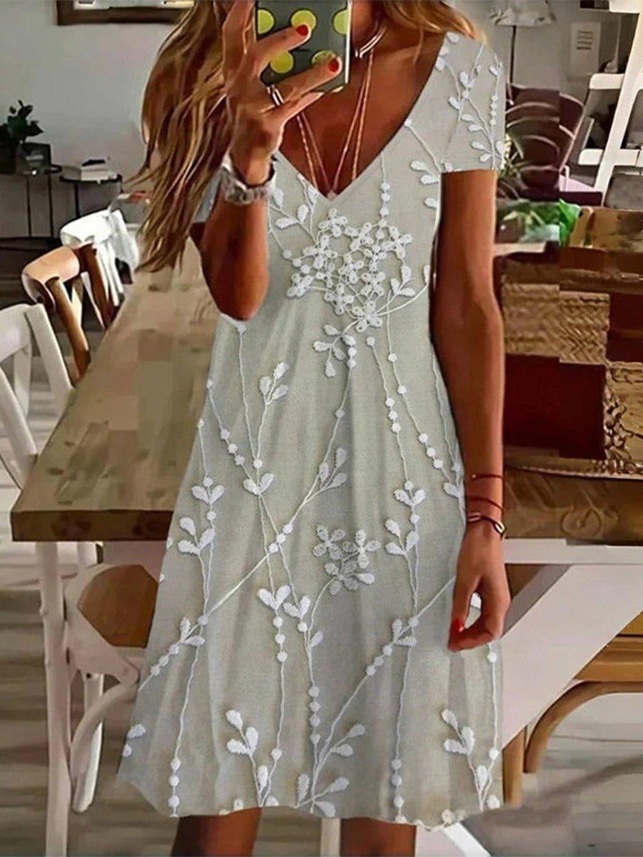 Vestido vintage corto de hojas con escote en pico y manga corta