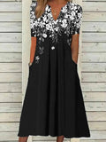 Vestido largo de flores con escote en pico, manga corta y bolsillos