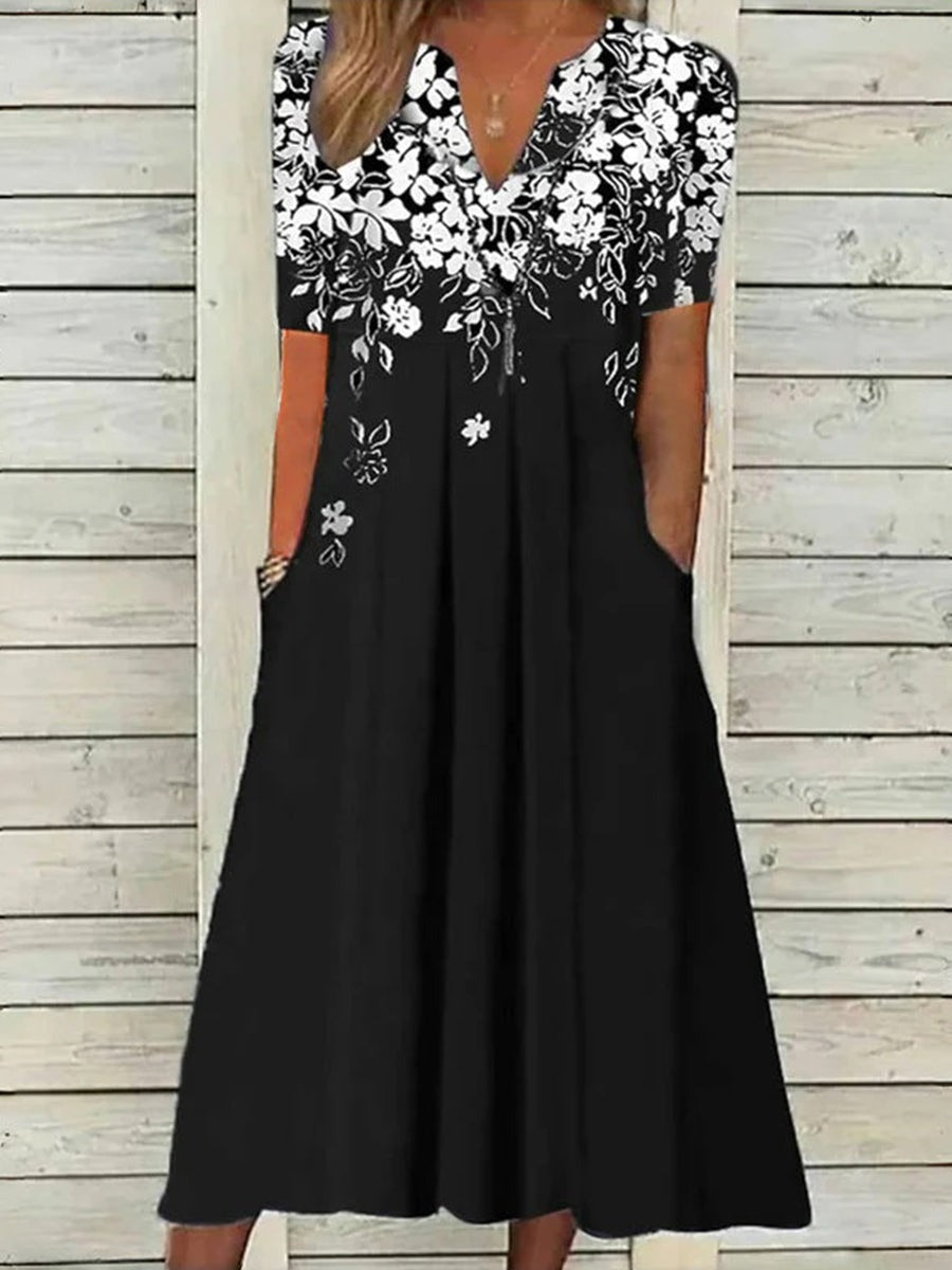 Vestido largo de flores con escote en pico, manga corta y bolsillos
