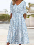 Vestido midi de flores con escote en pico y manga corta