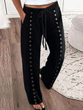 Pantalón casual negro con lazada en la cintura