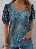 Camisa bordada azul con escote en pico y manga corta