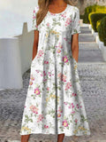 Vestido midi de flores con cuello redondo y manga corta · Tania