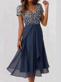 Vestido midi fluido con brillos con escote en pico y manga corta