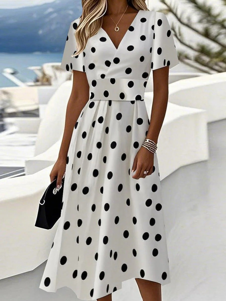 Vestido midi de talle alto de lunares con escote en pico y manga corta