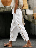 Pantalón de lino blanco con cordón ajustable y cordones