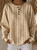 Top de rayas con cuello henley, manga larga y botones