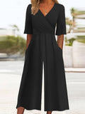Mono casual liso negro con manga corta y bolsillos