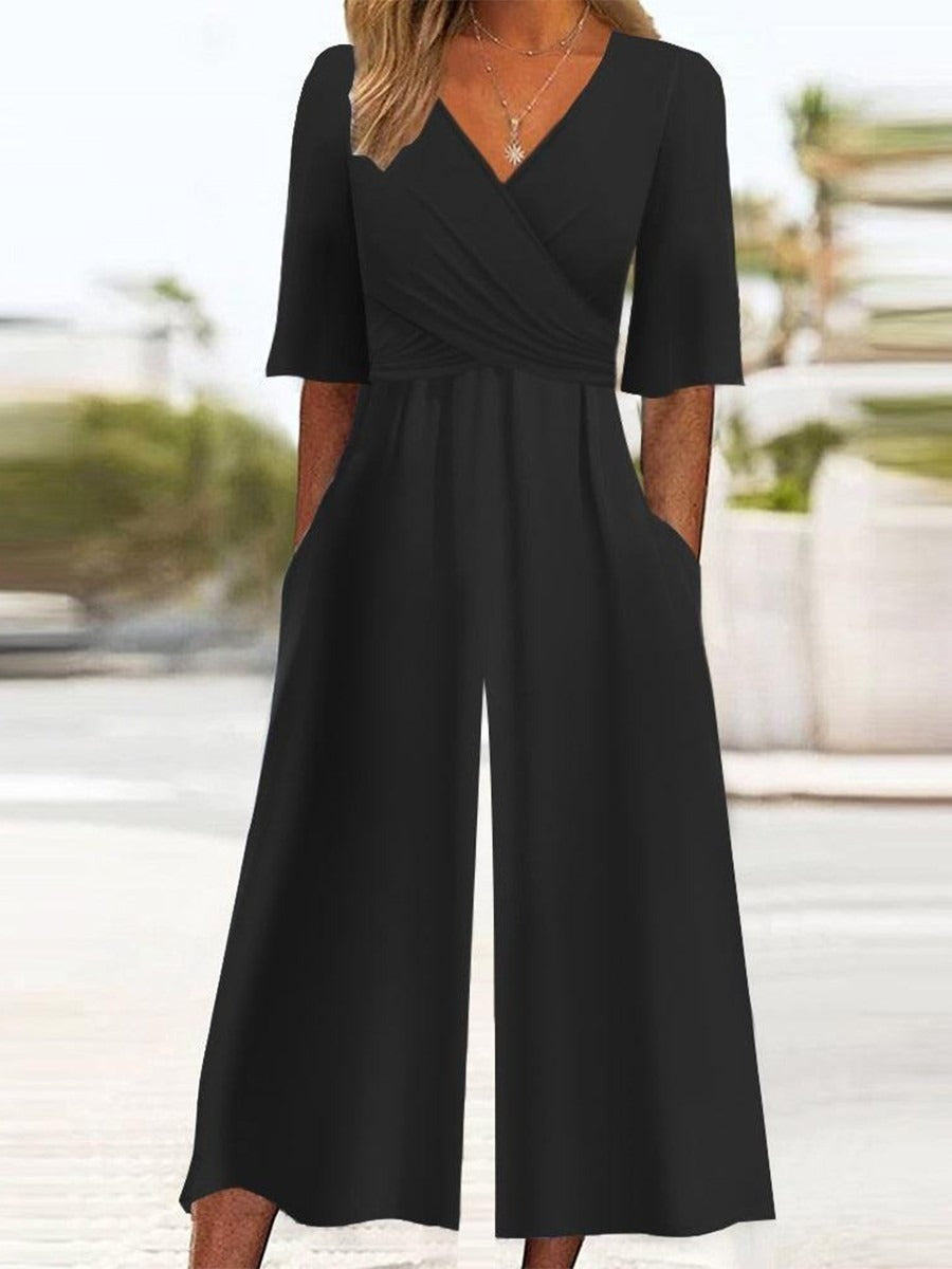 Mono casual liso negro con manga corta y bolsillos