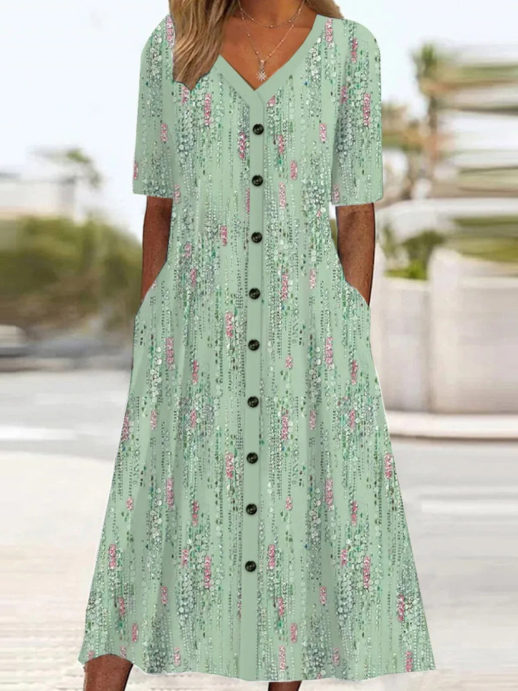 Vestido casual midi de flores verde con escote en pico y manga corta