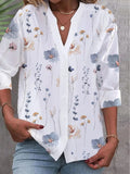 Blusa ligera de flores con escote en pico, manga larga y botones
