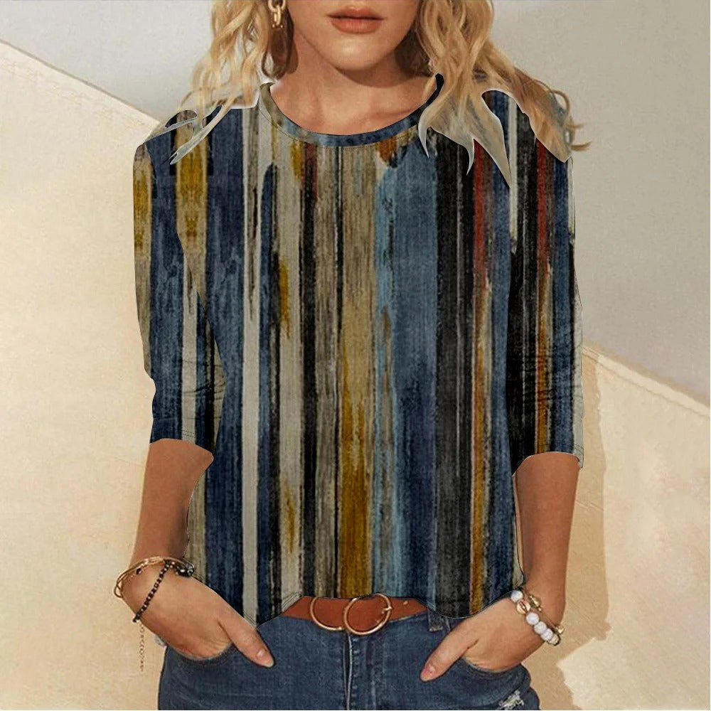 Camisa cómoda de rayas con cuello redondo y manga larga