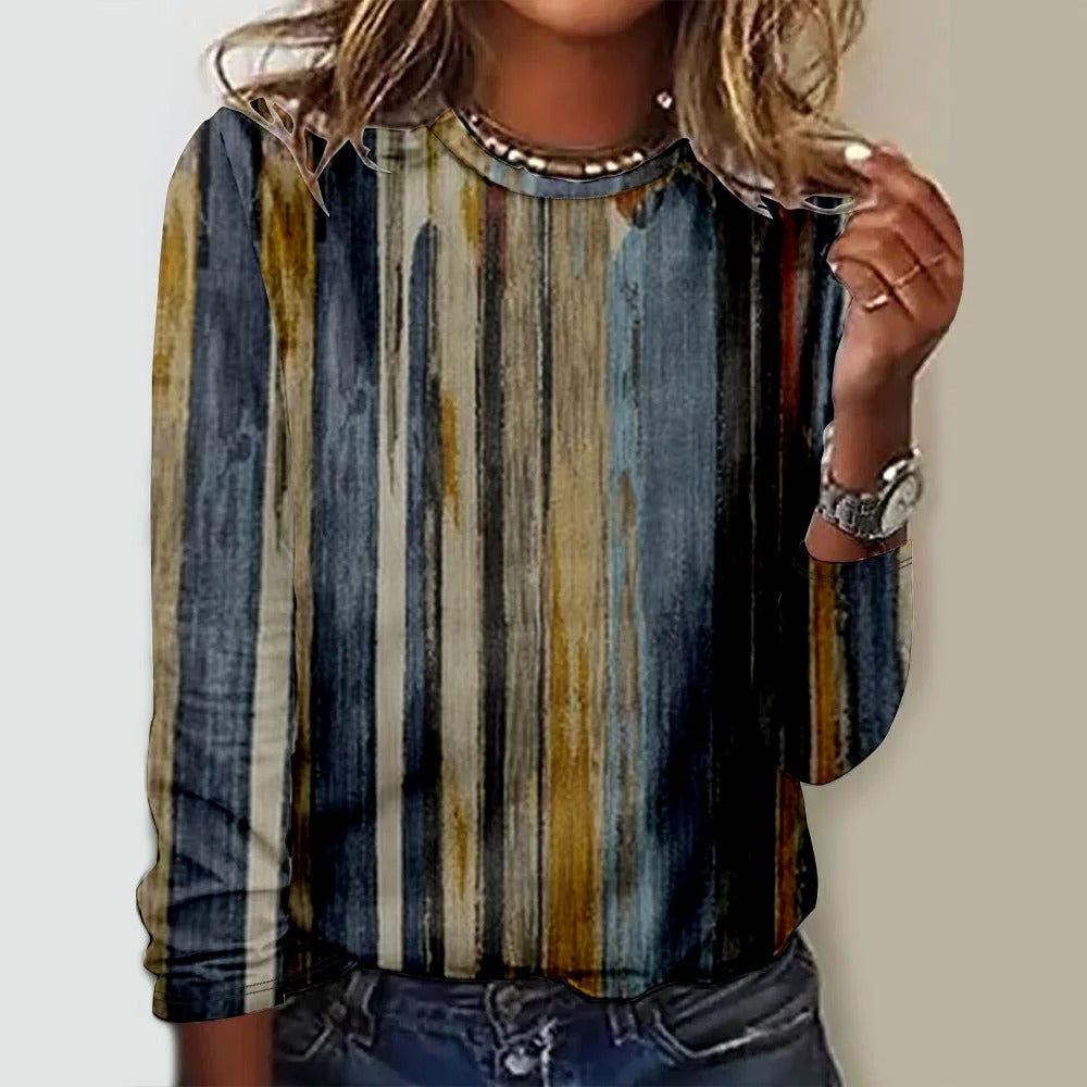 Camisa cómoda de rayas con cuello redondo y manga larga