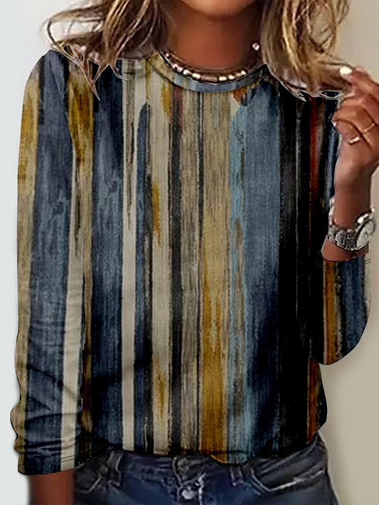 Camisa cómoda de rayas con cuello redondo y manga larga
