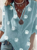 Top casual estampado con escote en pico y manga tres cuartos