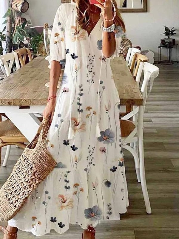 Vestido largo holgado de flores con escote en pico y manga francesa · Hilda