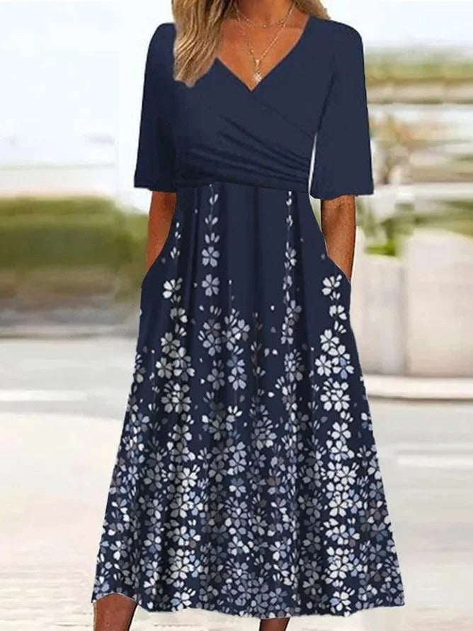 Vestido midi de flores azul marino con escote en pico y manga corta