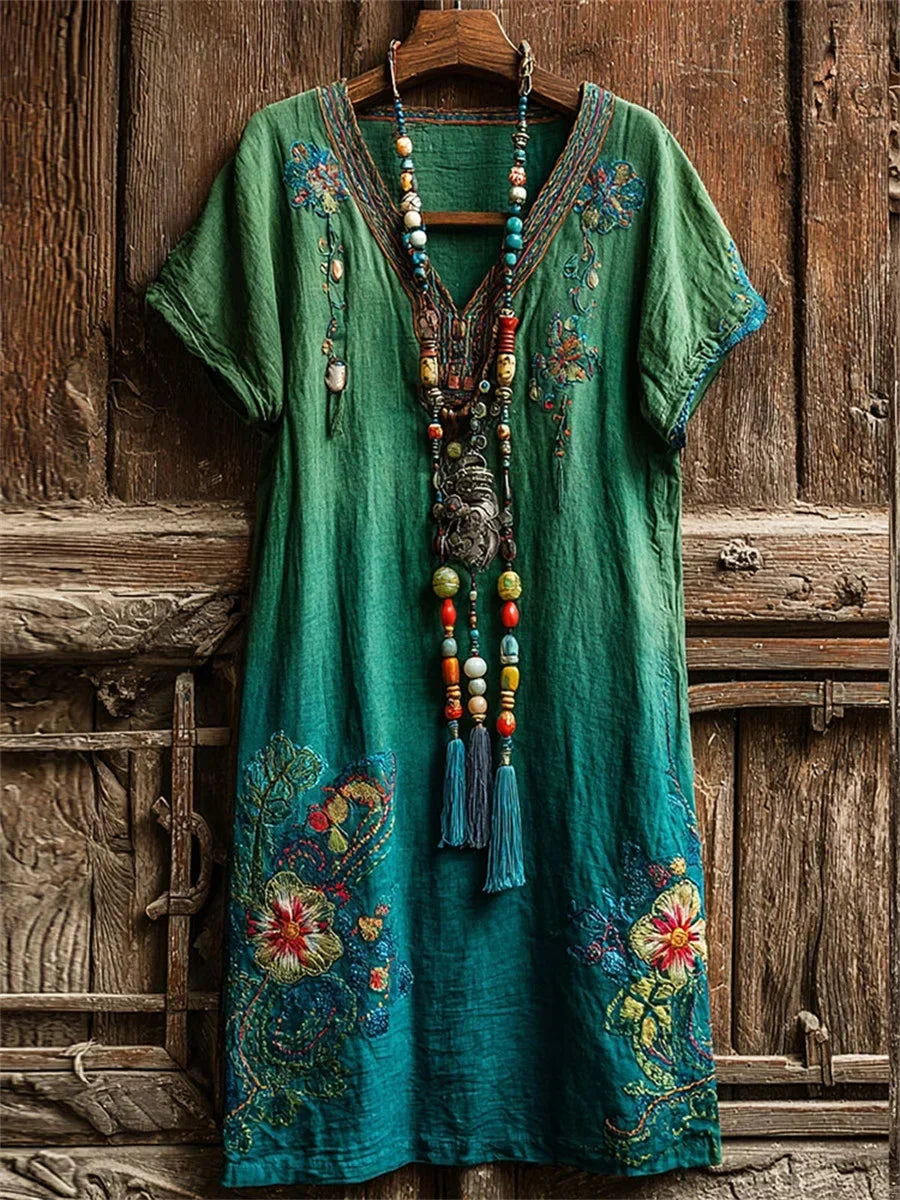 Vestido largo fluido de flores con escote en pico y manga corta
