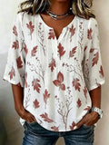 Blusa de hojas blanca con cuello henley
