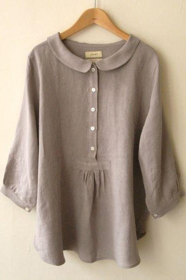Blusa lisa con cuello camisero, manga larga y botones