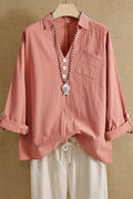 Blusa lisa con escote en pico, manga larga y bolsillos