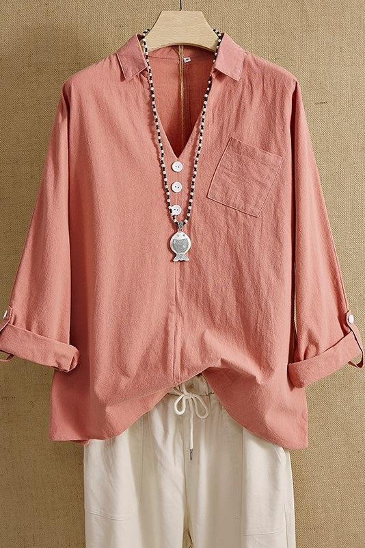 Blusa lisa con escote en pico, manga larga y bolsillos