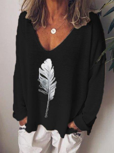 Blusa estampada con escote en pico y manga larga