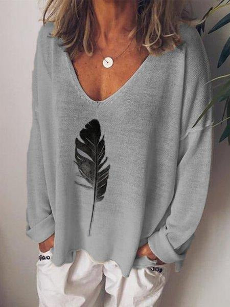 Blusa estampada con escote en pico y manga larga