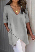 Blusa lisa con escote en pico, manga corta y bolsillos